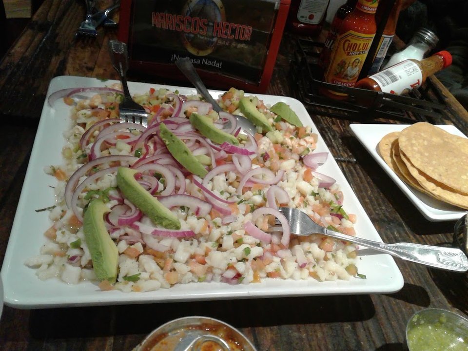 Menu page with seafood and Mexican dishes.