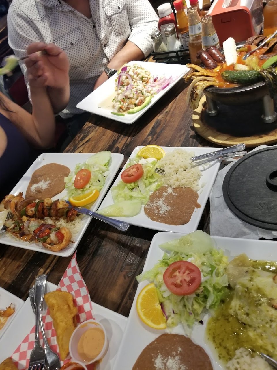 Menu layout featuring small plates and specialty dishes.